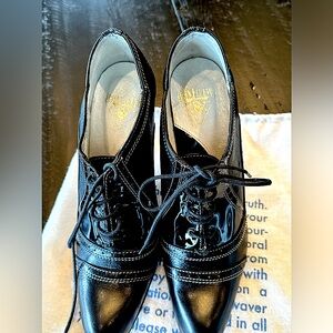 John Fleuvog lace up heels.